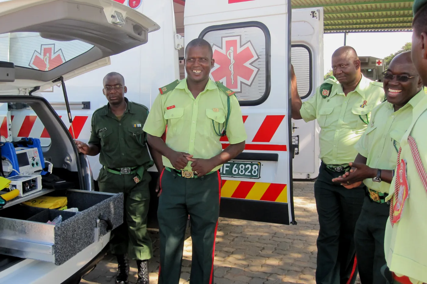 Paramedics standing beside an ambulance in Botswana