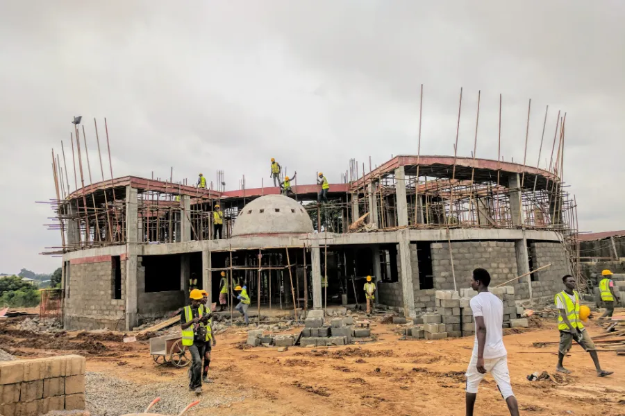 Bricklayers at work on a two-storey building site in Kwara State, Nigeria